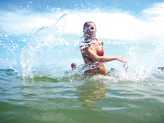 Girl plays in clear water