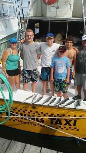Wanchese Fishing Charters, A family a boat in the ocean