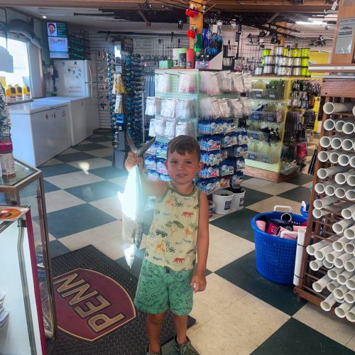 Red Drum Tackle Shop, Krue showing off his catch!!!