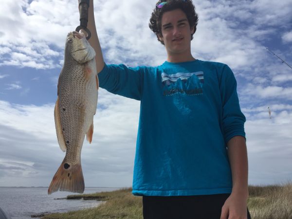 T-Time Charters, Forrest put a keeper redfish in the box